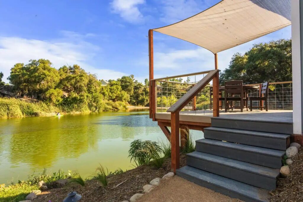 Porch view of lake in front of cabin at native falls